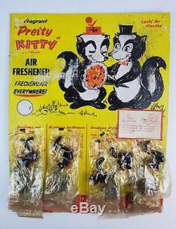 1961 Pretty Kitty Skunk Car Air freshener store display with small plush skunks