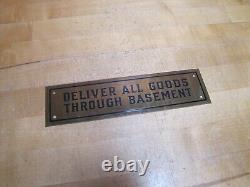 DELIVER ALL GOODS THROUGH BASEMENT Original Old Brass Store Display Sign