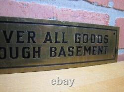 DELIVER ALL GOODS THROUGH BASEMENT Original Old Brass Store Display Sign