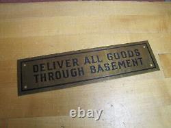 DELIVER ALL GOODS THROUGH BASEMENT Original Old Brass Store Display Sign