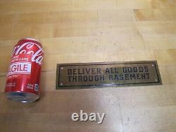 DELIVER ALL GOODS THROUGH BASEMENT Original Old Brass Store Display Sign