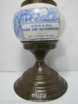 Karat & Dial Clock and Watchmakers Advertising Store Display Sign Ad Oil Lamp