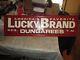 Lucky Brand Dungarees Advertising Metal Store Display Sign 48.5 X 13.5 NICE